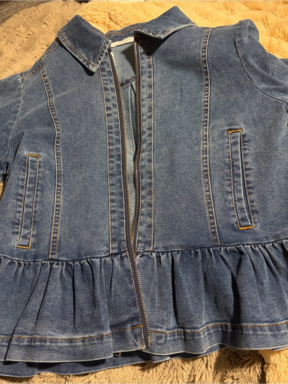 Woman’s  Denim Ruffle Hem Jacket sixty five brand size small.  - Blue